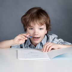Happy student sitting at desk