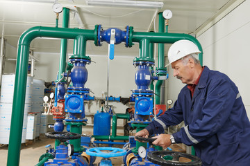 Fototapeta premium heating engineer repairman in boiler room
