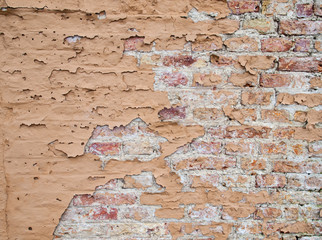 brick wall with flaking paint