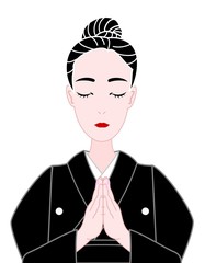 喪服で合掌する女性