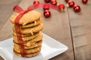 Stack of Christmas Cookies tied with red ribbon