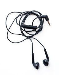 black earphones on a white background
