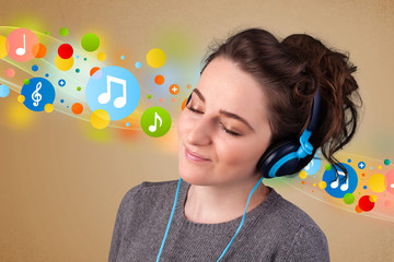 Young woman listening to music with headphones