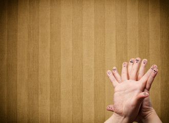 Happy finger smileys with vintage stripe wallpaper background