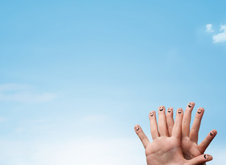 Happy smiley fingers looking at clear blue sky copyspace