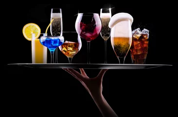 Wall murals Bar different alcohol drinks set on a tray