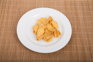 Corn Chips on White Plate and Bamboo Placemat
