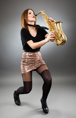 Young lady playing the saxophone