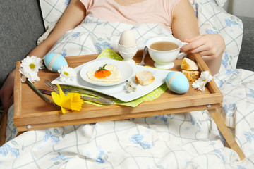 Tray with breakfast on a bed