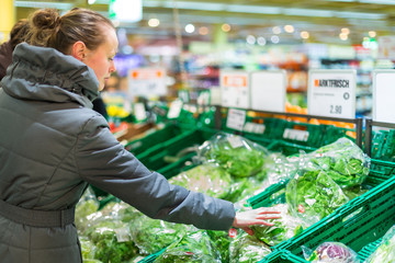 Beautiful, young woman shopping for fruits and vegetables
