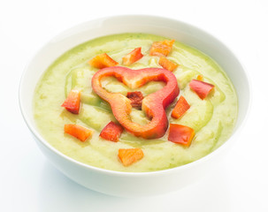 vegetable puree garnished with red pepper in white bowl