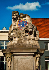 Historical sculpture with lion and bear in Bruges