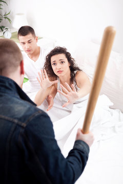 caught in cheating, angry husband holding the hatchet, a woman a