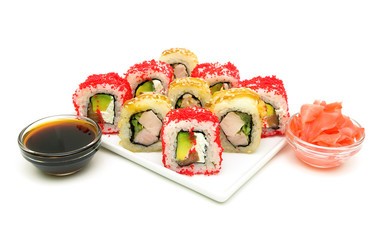 different rolls, ginger and soy sauce on a white background