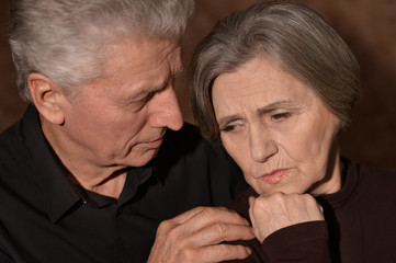 Sad elder couple