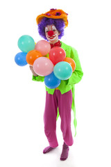 child dressed as colorful funny clown with balloons