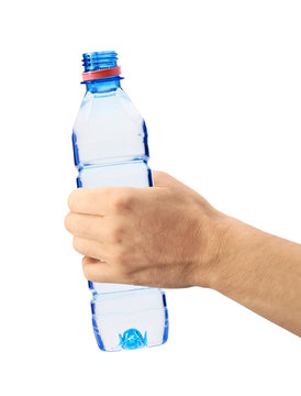 Human hand holding a bottle of water isolated on white