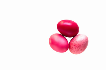 Redd and pink easter eggs isolated on white