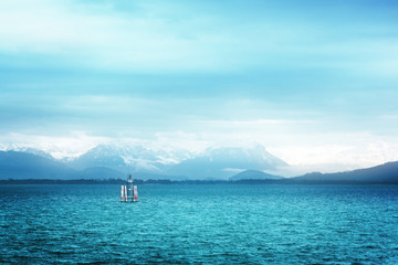 Surreal view of Bodensee with the Alps in the background