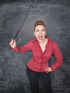 Angry screaming teacher with whip