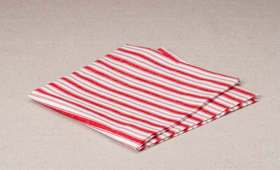 Red White Folded Napkin On Natural Linen Background