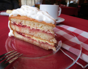 Strawberry layer cake topped with whipped cream