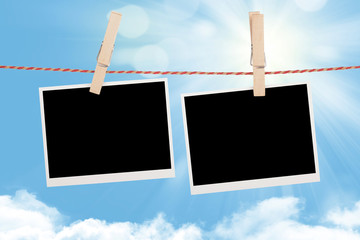 Blank photos hanging on clothesline
