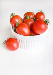 сherry tomatoes in a bowl  on white background