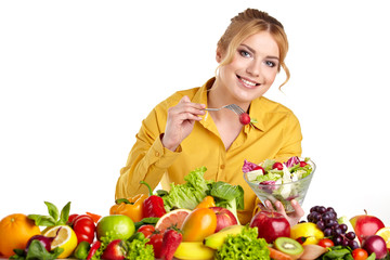 Happy young woman with vegetables and fruits. Isolated over whit