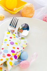 Easter table setting silverware wrapped napkin