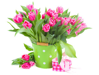 bouquet of pink tulips in green pot