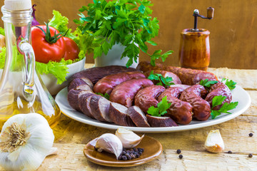 Table plate sliced ​​sausages vegetables