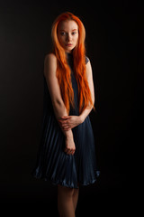 Fototapeta premium Red hair against dark background