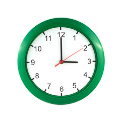 Three o'clock on big wall clock in green case isolated