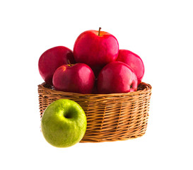 Red and green apples in a wooden basket