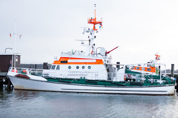 Naklejka premium Cabin cruiser moored in the harbour