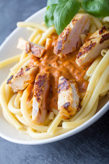 pasta with tomato sauce and chicken breast