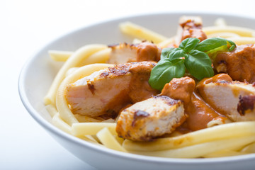 pasta with tomato sauce and chicken breast