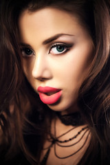 Fototapeta premium Portrait Of Sexy Woman On a dark metallic Background