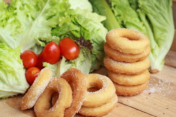 donut and sugar - fresh vegetable salad.