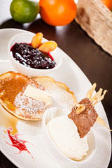 tasty sweet pancakes with vanilla icecream and topping