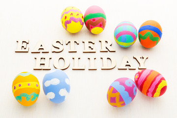 Pattern easter egg with wooden text