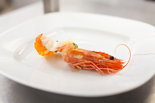 Chef Plating Up Seafood Pasta