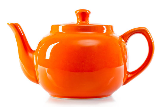 Bright Orange Teapot On A White Background