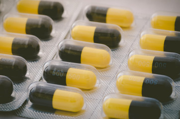 Black and yellow capsule