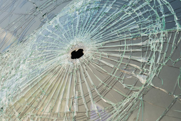 Car with bullet holes in the windshield