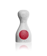 Wooden pawn with a painting of a flag