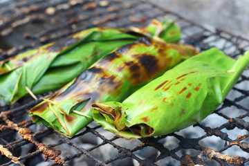 Sticky rice wrapped in banana leaves grill