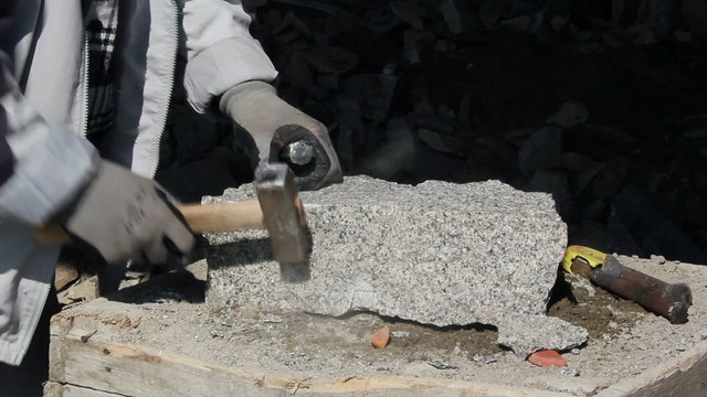 Stonemason is working on a sett