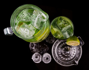 Lime juice over black background